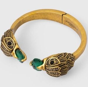 Kurt Geiger Gold Bracelet with Green Eagle Design